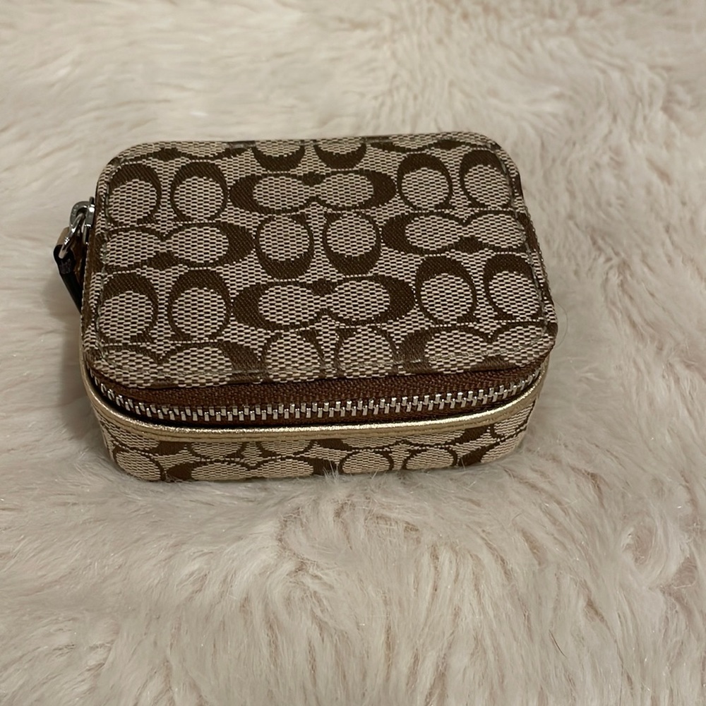 Coach gold logo pill case